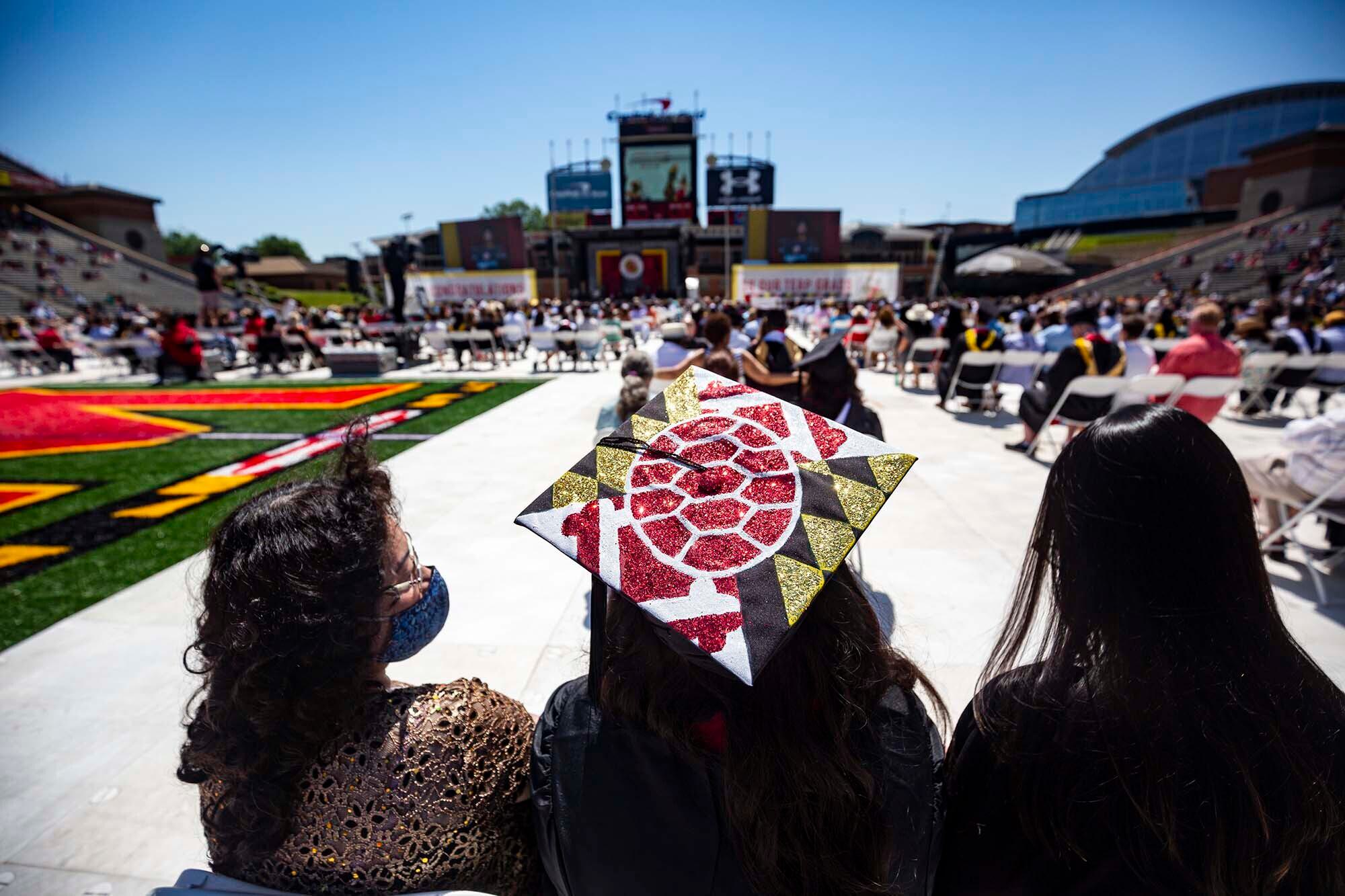 A painted graduation cap in UMD colors